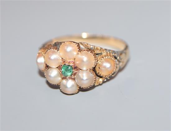 A late Victorian yellow metal, split pearl and emerald cluster dress ring, size K/L.